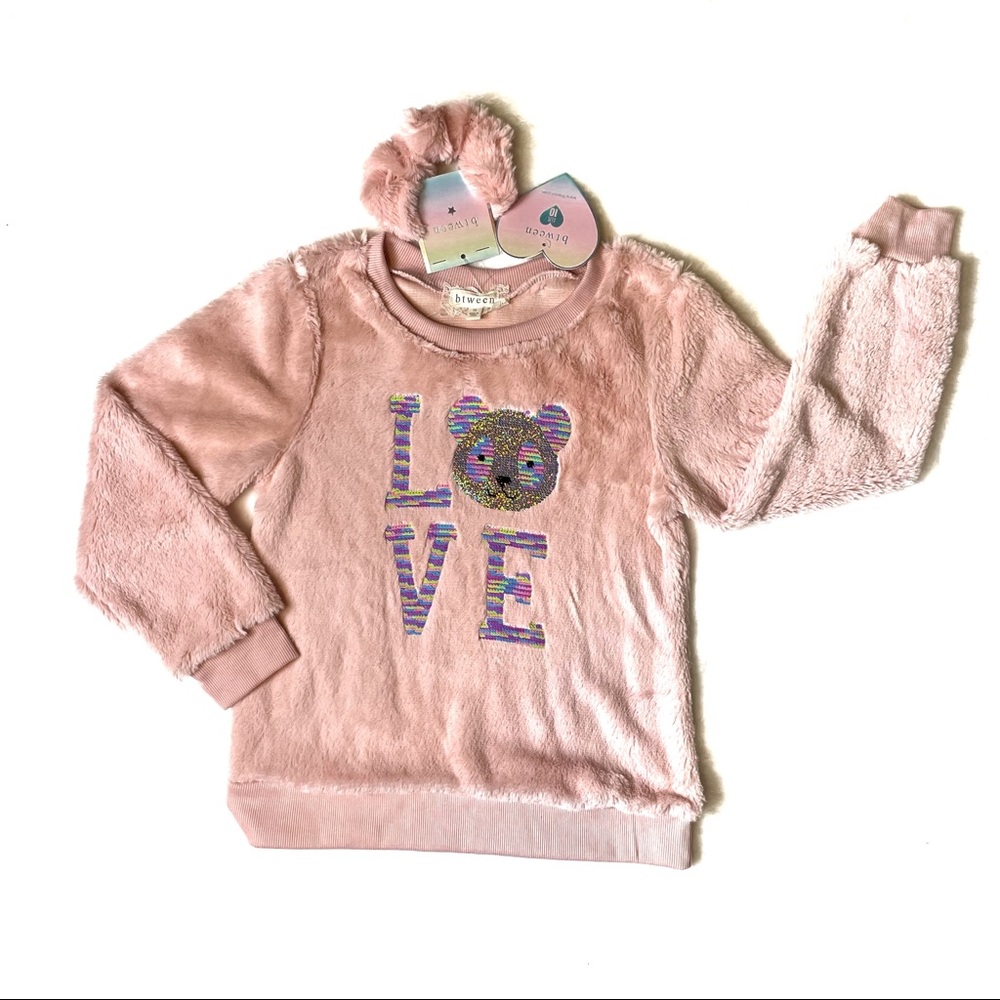 NWT between top with sequins appliqué